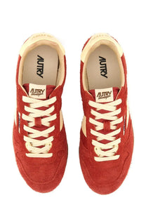 Autry women’s Windspin low sneaker in red suede with cream-colored laces and accents