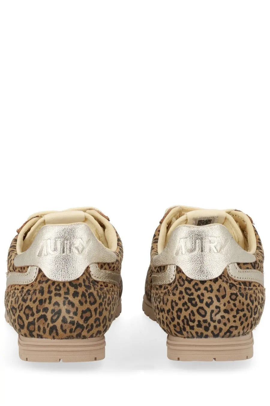 Autry women’s windspin sneaker with leopard print upper metallic silver heel tabs and beige soles shown from back side