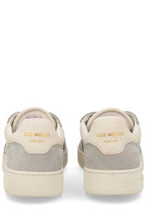Beige and gray suede low-top axel arigato men’s sneaker dice grey showing gold branding on the heel back view