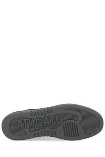 Dark gray rubber sole of axel arigato men’s sneaker dice toe black with embossed branding and textured grip patterns