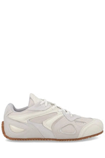 Axel Arigato men’s sneaker slow runner white in cream with suede synthetic mix geometric cutouts and gum rubber sole