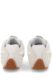Axel Arigato men’s sneaker slow runner white with textured tan rubber sole and subtle stitching details