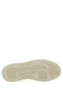 Cream-colored rubber sole with embossed arigato branding and textured grip on axel arigato women’s says lo bee bird sneaker white