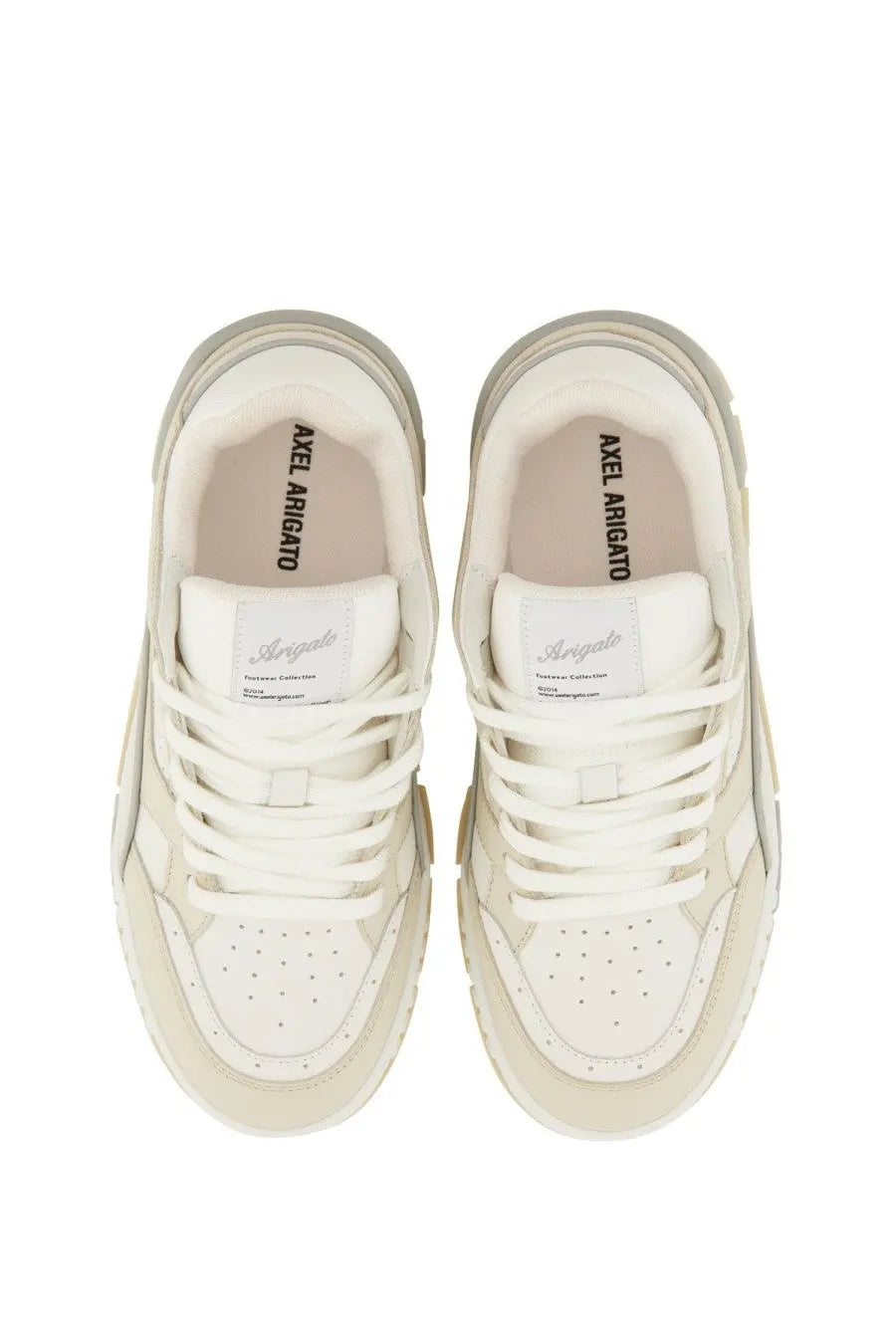 Cream-colored axel arigato women’s sneaker lo area white with chunky sole and perforated toe box
