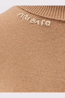 Axel Arigato women’s beige wool blend turtleneck sweater with cream embroidered Ariat logo at the neckline