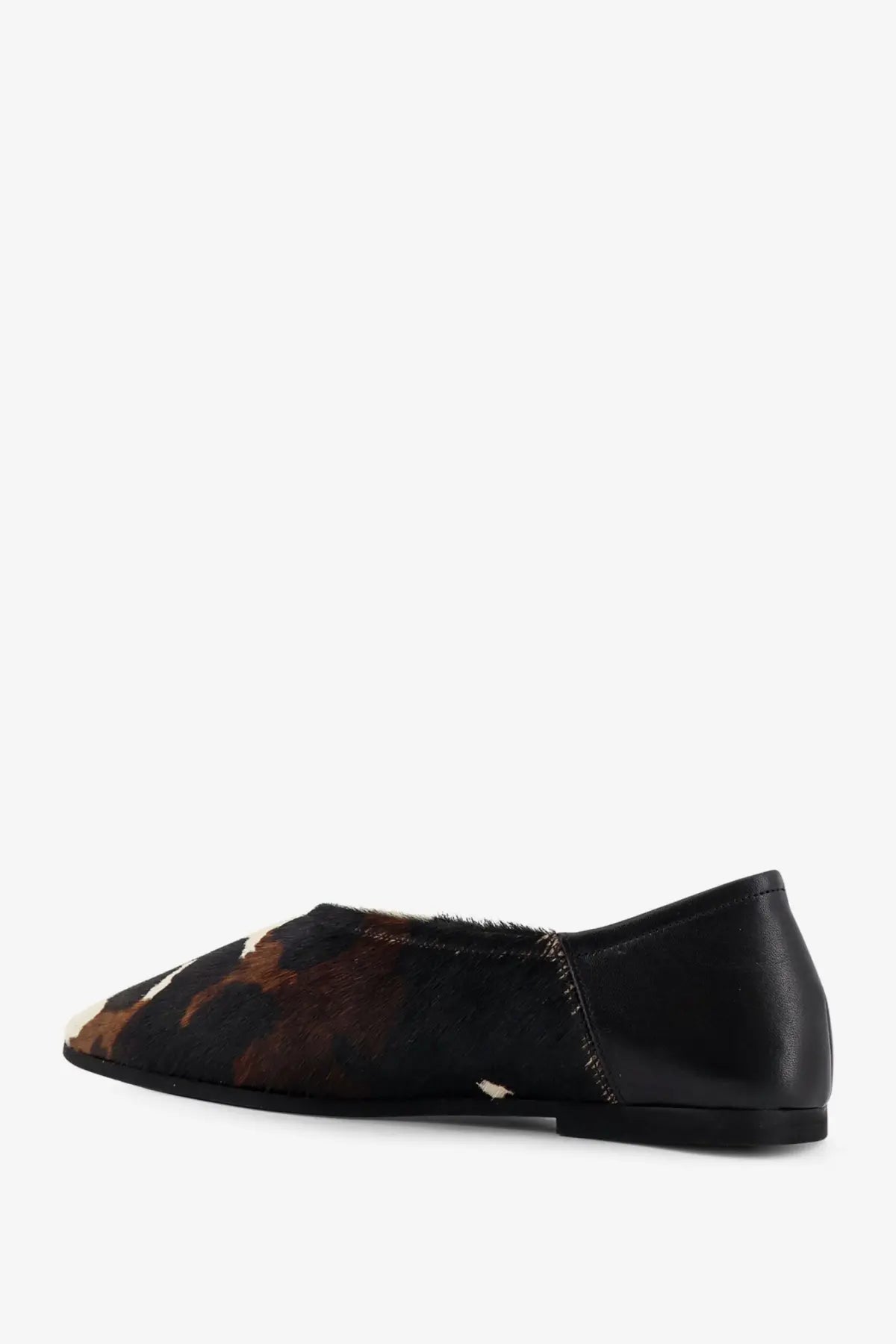 Babú Milano women’s ponyskin ballerina flat shoe in black leather with a brown black and white cowhide patch
