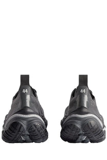 Balenciaga men’s anatomic runner sneaker grey with black glossy finish and chunky rubber soles shown from the back