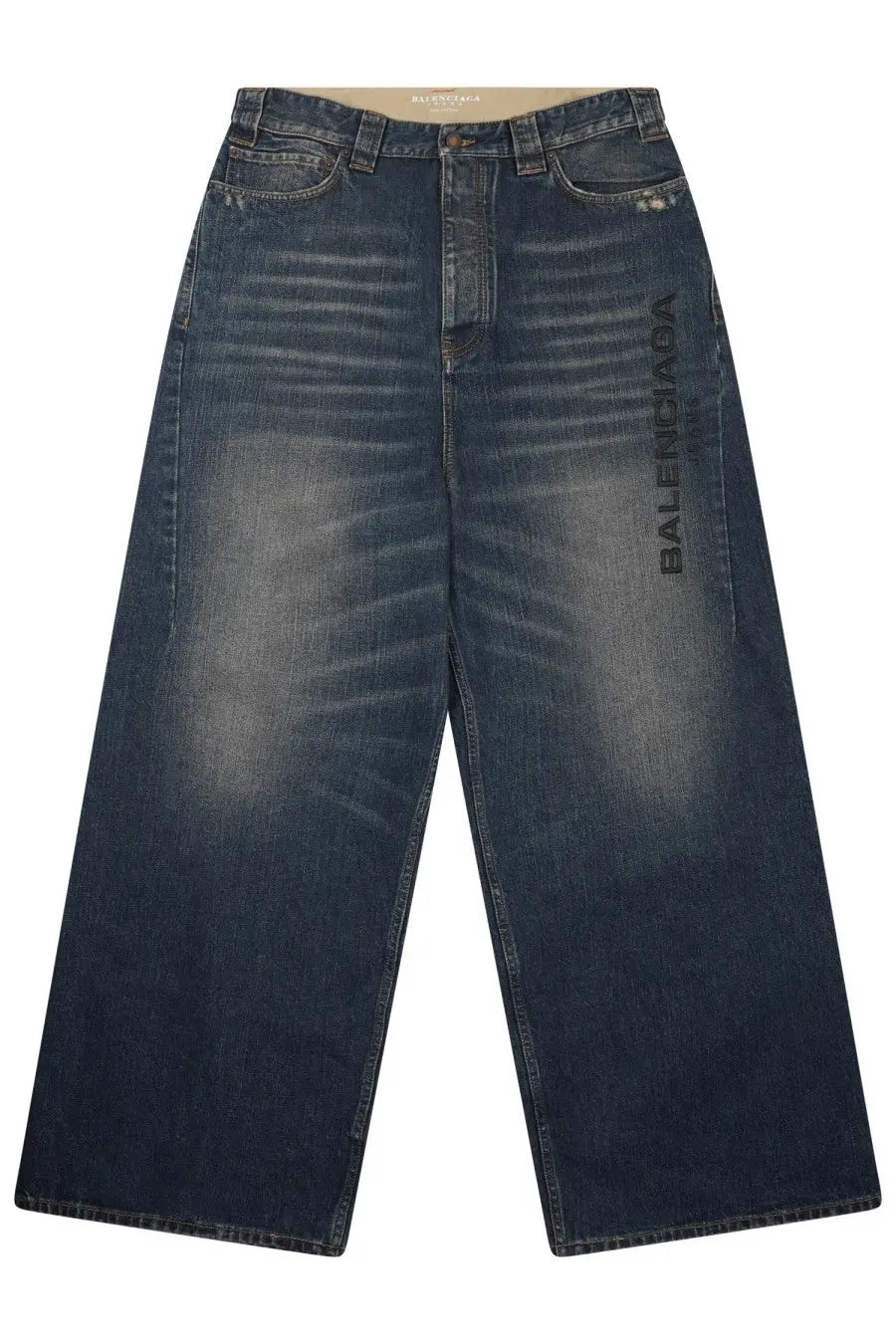 Balenciaga men’s dark blue denim baggy pants with faded wash and vertical logo print on the left leg