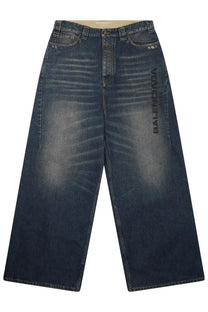 Balenciaga men’s dark blue denim baggy pants with faded wash and vertical logo print on the left leg
