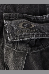 Balenciaga men’s cargo black denim trousers in dark gray distressed denim with visible brand label on back pocket