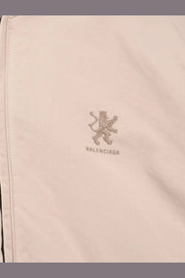 Balenciaga men’s beige cotton blend jacket with subtle cream embroidered lion logo and matching brand name thread
