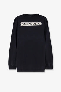 Balenciaga mens black cotton long-sleeved sweatshirt with white torn paper style logo on the back side