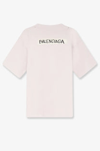 Balenciaga men’s cotton shirt white showing the back side with a pale pink color and bold black logo print