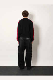 Balenciaga men’s cotton sweater black paired with black cargo pants featuring reinforced stitching and multiple pockets