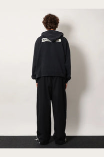 Balenciaga men’s black cotton sweatshirt showing the back with a white logo across the hoodie