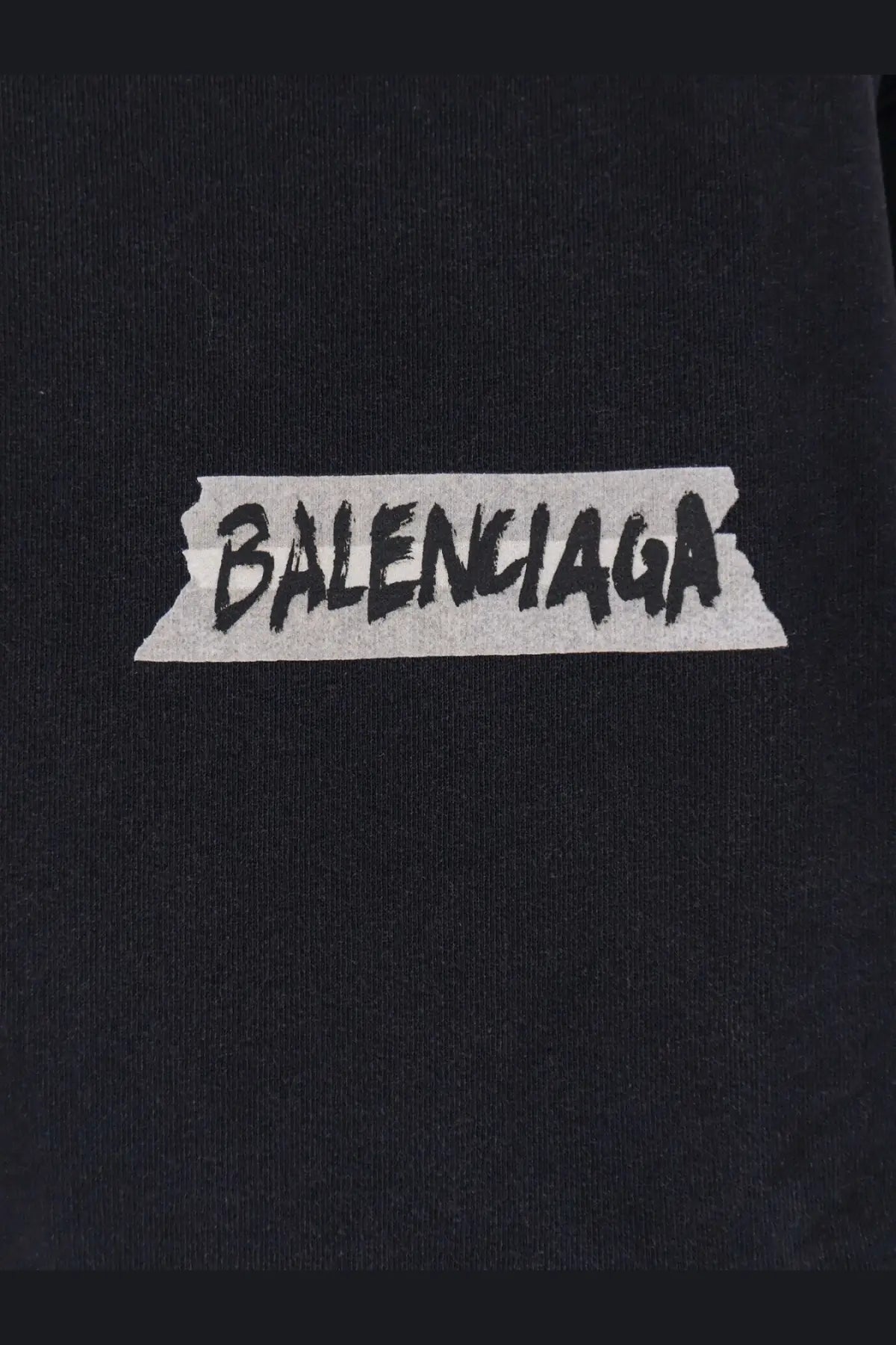 Black balenciaga logo patch with distressed tape design on balenciaga men’s black cotton sweatshirt front