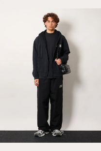 Black textured crossbody bag with minimalist design and subtle branding perfect for balenciaga men’s cotton sweatshirt black look