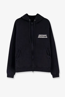 Balenciaga men’s black cotton zip-up hoodie with white graffiti-style logo on the chest