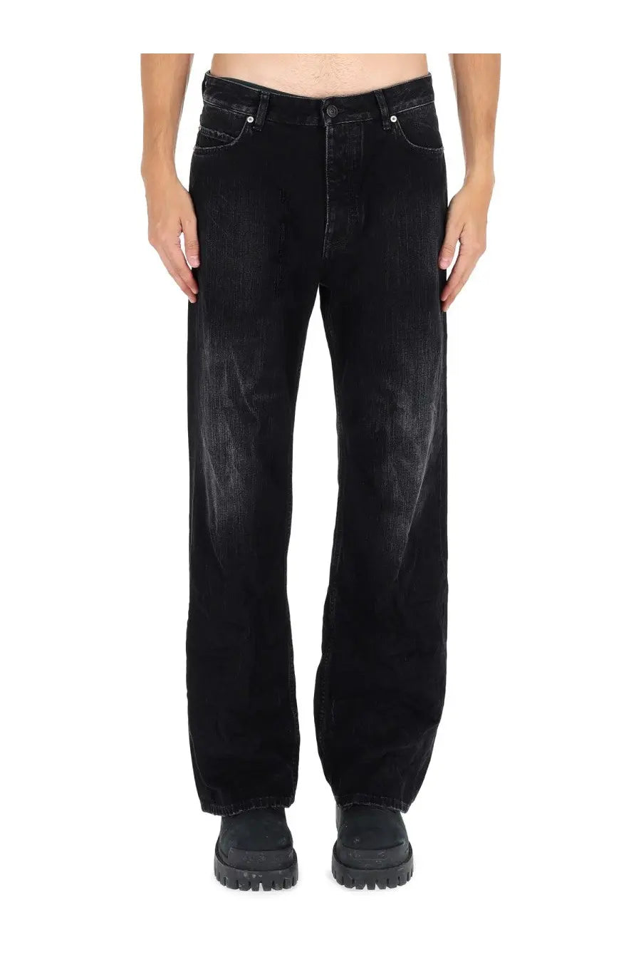 Balenciaga men’s deconstructed black denim jeans with faded distressed look and wide-leg cut front view