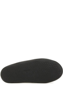 Black rubber sole with textured circular grip pattern of balenciaga men’s flat sabot chateau black shoes