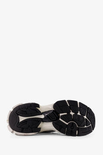 Black and translucent rubber sole with chunky layered design and white accents on Balenciaga men’s runner sneakers white