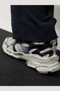 Balenciaga men’s mesh and nylon runner sneakers white with black detailing and chunky layered design