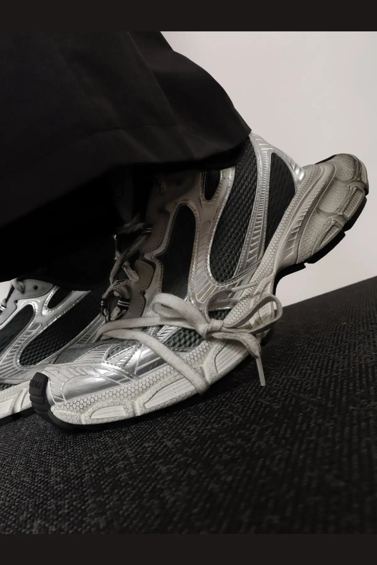 Silver and black balenciaga men’s mesh and nylon triple s sneakers with a chunky futuristic design in black