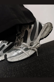Silver and black balenciaga men’s mesh and nylon triple s sneakers with a chunky futuristic design in black