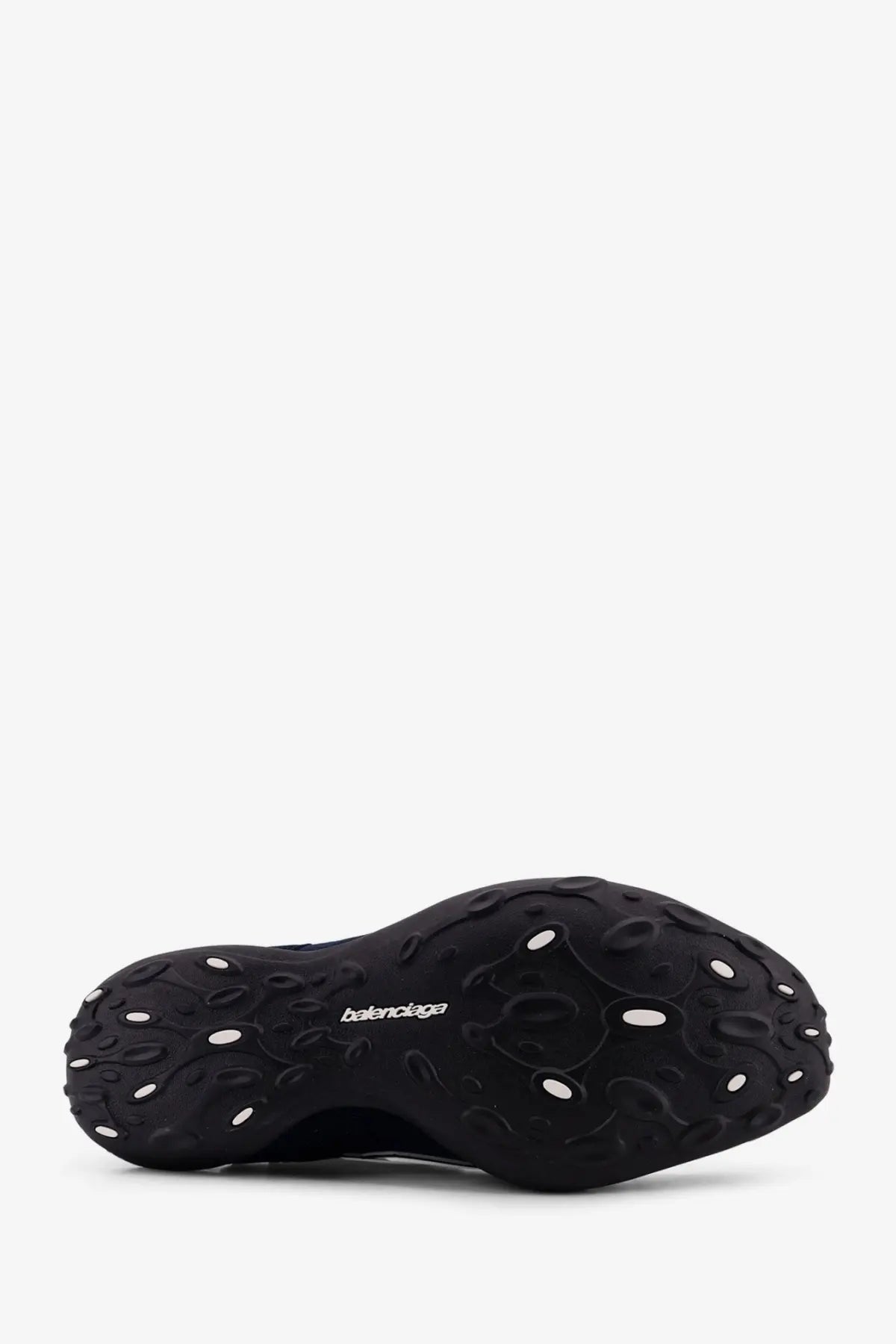 Balenciaga men’s monday ultra sneaker blue featuring a black textured sculpted sole with white circular accents