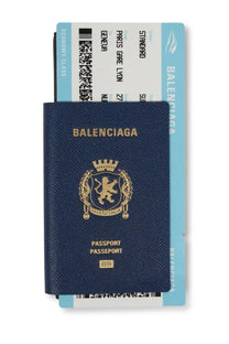 Balenciaga men’s passport wallet in navy blue textured leather with gold embossed logo and text front view