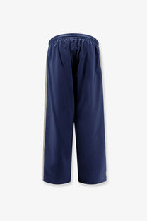 Balenciaga men’s sporty nylon trousers in navy blue with light gray vertical stripes for athletic use
