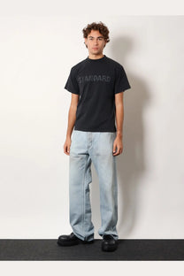Balenciaga men’s black cotton t-shirt with short sleeves and standard printed in a subtle textured font across chest