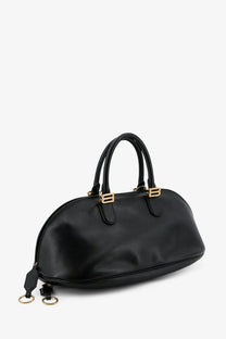 Balenciaga women’s bolero bowling medium leather bag in black with gold-tone hardware and structured dome shape