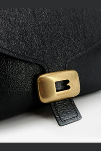 Balenciaga women’s clicca arena medium shoulder bag in black textured leather with gold tone logo clasp