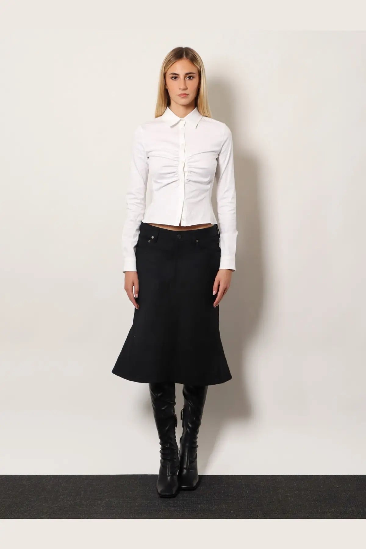 White long-sleeved cotton shirt with ruched detailing paired with balenciaga women’s cotton midi skirt black
