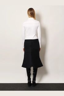 Balenciaga women’s cotton shirt white paired with a black high-waisted flared skirt featuring subtle side seam detailing