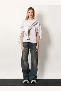 Balenciaga women’s cotton shirt white oversized light gray sweatshirt with draped asymmetrical design over jeans