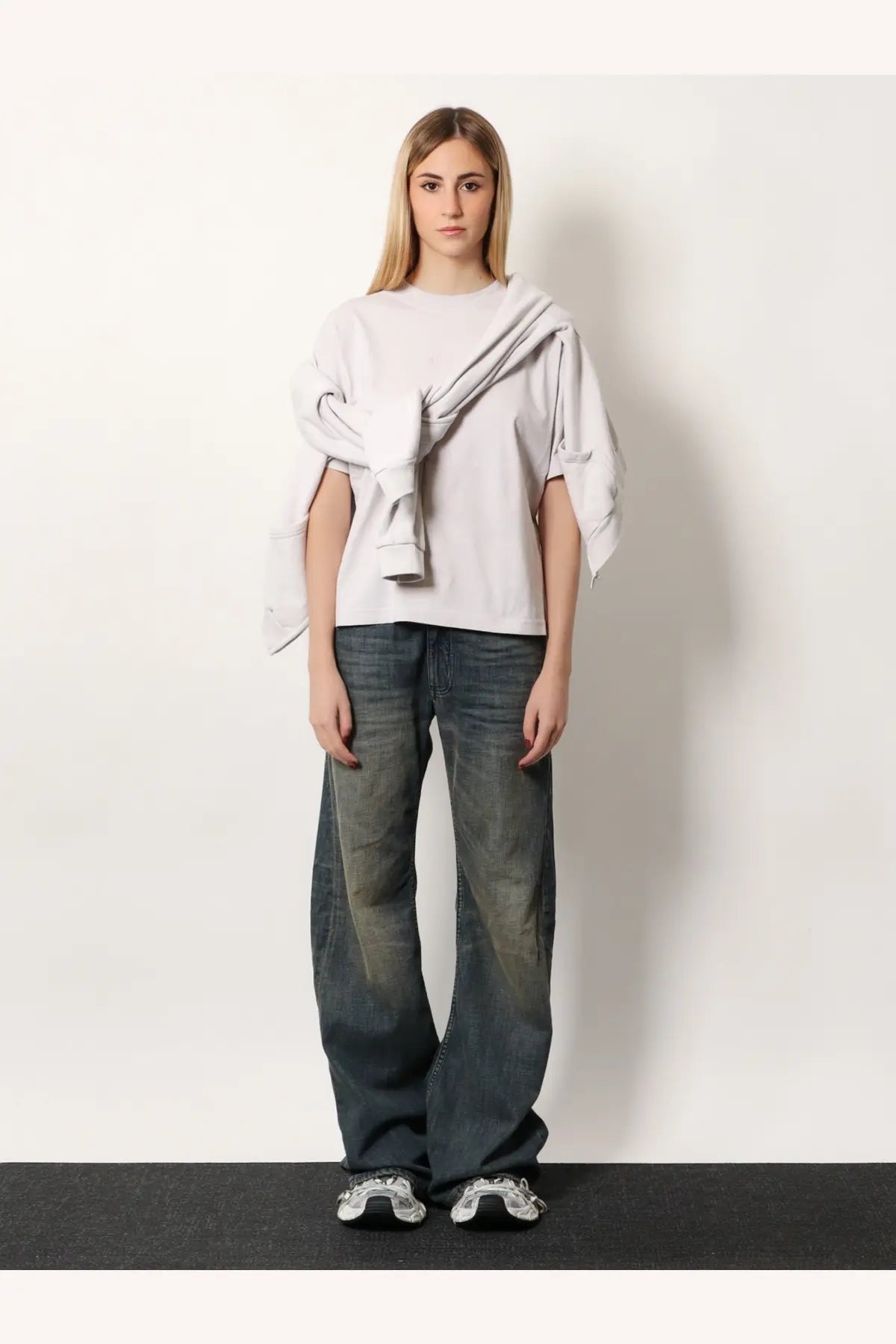 Balenciaga women’s white cotton shirt styled as a light gray oversized sweatshirt with draped asymmetrical design