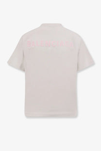 Balenciaga women’s pale pink cotton short-sleeved polo shirt showing back with subtle matching embroidered logo