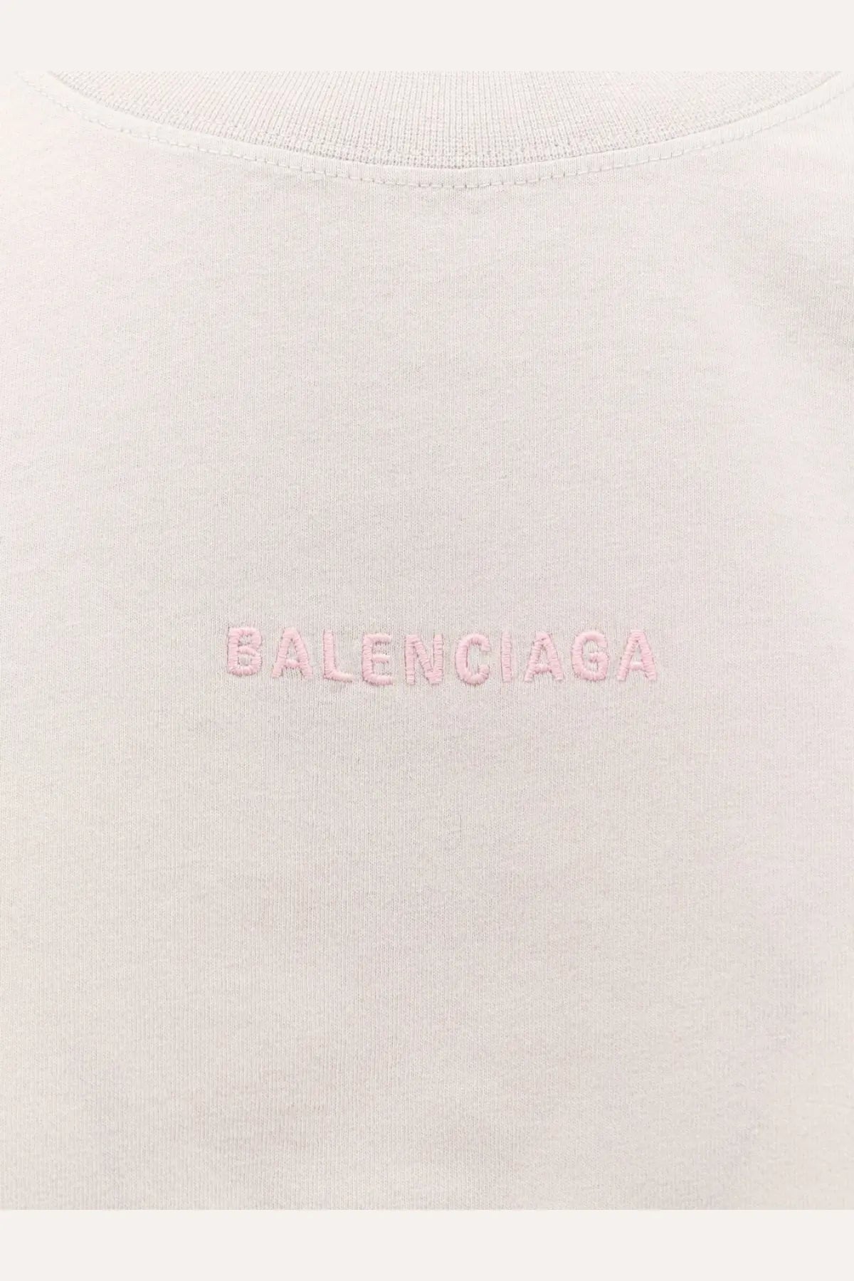 Balenciaga women’s cotton shirt white featuring a soft off-white fabric with subtle pink embroidered logo on the chest
