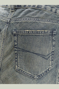 Balenciaga women’s denim midi skirt blue showing the faded blue denim back pocket with reinforced stitching
