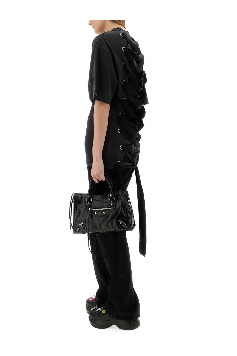 Balenciaga women’s lace up shirt black paired with black patent leather Balenciaga city bag with silver hardware and dual handles