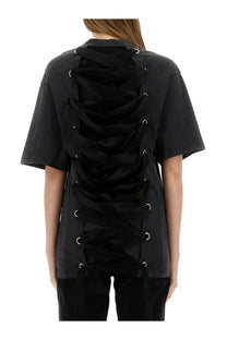 Back view of balenciaga women’s black short-sleeved shirt with lace-up ribbons through silver eyelets