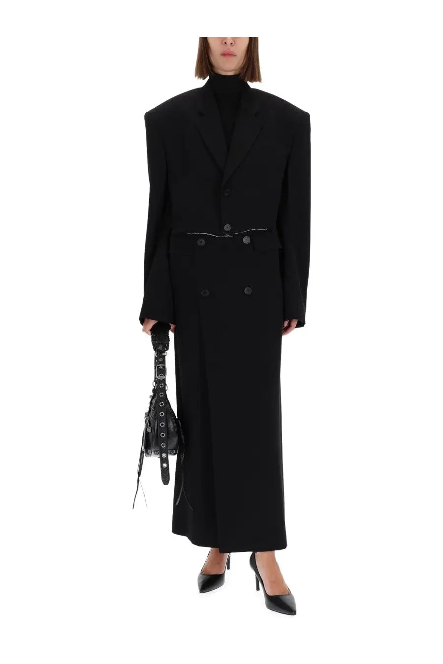 Balenciaga women’s black long sartorial skirt paired with a black structured double-breasted belted coat