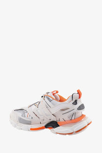 Balenciaga women’s white and orange triple s sneaker with chunky sole and mesh and synthetic overlays