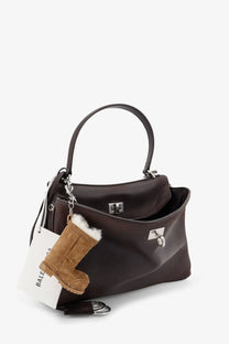 Balenciaga women’s rodeo leather crossbody bag brown with silver hardware and detachable strap featuring tan boot charm