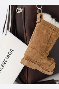 Tan suede boot-shaped keychain with white faux fur lining and balenciaga logo for womens rodeo leather crossbody bag brown