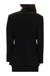 Balenciaga women’s sartorial jacket in black with structured shoulders and sleek minimalist tailored design