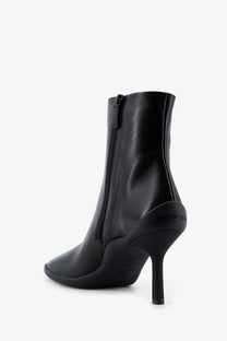 Balenciaga women’s shibuya leather ankle boot in black featuring a sleek design and high stiletto heel