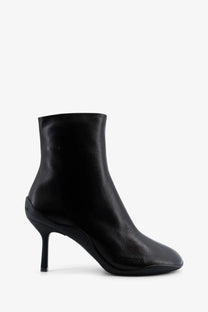 Balenciaga women’s Shibuya black leather ankle boot with sleek minimalist design and slender high heel